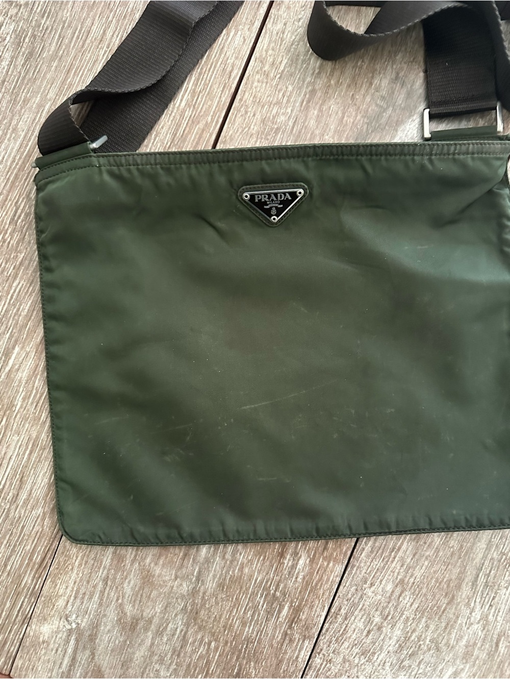 Prada Army Green Nylon Bag with brown adjustable strap with silver hardware.